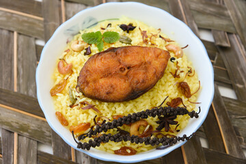 Fish biryani. Spicy and delicious Malabar biryani or Hydrabadi  biryani, Dum Biriyani,  pulao basmati rice, herbs, raitha for Ramadan Kareem, Eid