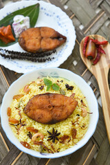Fish biryani. Spicy and delicious Malabar biryani or Hydrabadi  biryani, Dum Biriyani,  pulao basmati rice, herbs, raitha for Ramadan Kareem, Eid