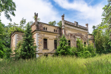 Fototapeta na wymiar Vrsac, Serbia - June 04, 2020: The castle of the Lazarevic family in Veliko Srediste, in the municipality of Vršac, has been built since the middle of the 19th century. Abandoned castle