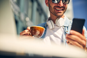 Close up of cheerful man that reading news online
