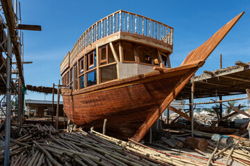 Traditional dhow under construction in wahrf in Sur, Oman