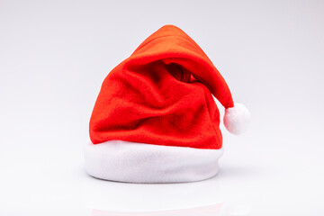Red and white Christmas hat isolated in front of a white background