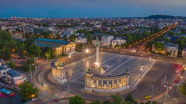 Budapest, Hungary - 4K moving time-lapse (hyperlapse) footage of drone flying around the beautiful Heroes Square at City Park (Varosliget) at dusk during the lights go on