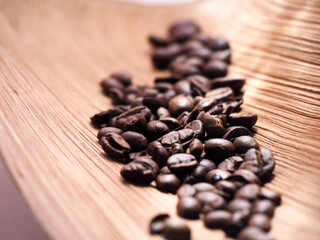 coffee beans in a bag on wooden background.