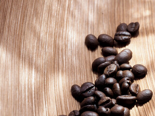 coffee beans in a bag on wooden background.