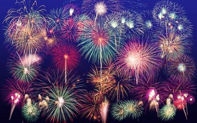 Fototapeta na wymiar colorful fireworks fully shining on dark blue background