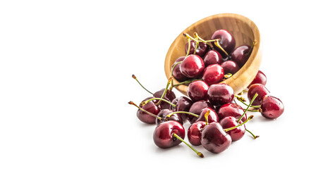 Sweet ripe cherries in bowl isolated on white background