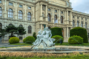 Fototapeta na wymiar Hoffburg Imperial Palace in Vienna, Austria. Luxurious baroque facade and green summer park