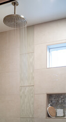 Rainfall showerhead in simnple modern and stylish shower with running water
