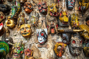 wall covered in tradtional masks in Antigua, Guatemala