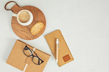 Styled minimal desktop mockup with organic color stationary, coffee cup. Freelancer, social media blogger concept. Flat lay, top view