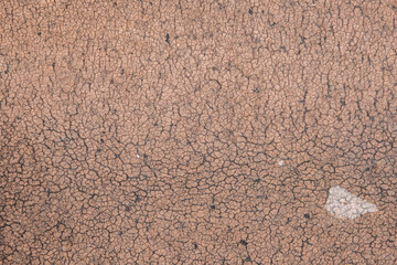 background and texture trodden by the feet of clay. The sidewalk is in a rural location