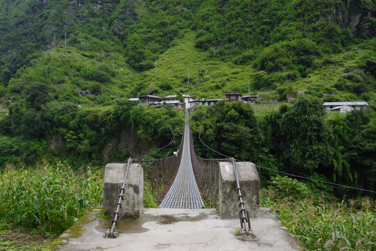 Long suspension bridge to Ngadi. Bridge across Marsyangdi river on the Annapurna circuit.