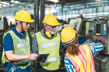 Industrial Engineers in Hard Hats.Work at the Heavy Industry Manufacturing Factory.industrial worker indoors in factory.aged man working in an industrial factory.