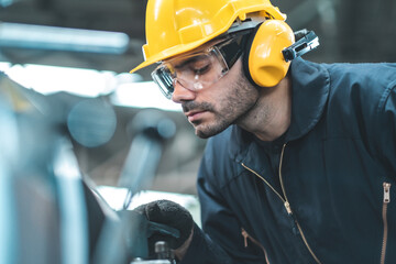 Industrial Engineers in Hard Hats.Work at the Heavy Industry Manufacturing Factory.industrial worker indoors in factory. man working in an industrial factory.Safety first concept.