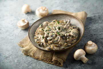 Obraz na płótnie Canvas Homemade mushroom ragout with cream and parsley