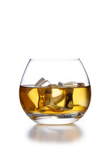 A isolated bowl style glass of whisky and ice, shot on white