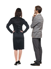 Back view of business woman and business man in suit.