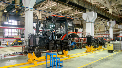 Fototapeta premium tractor Assembly on the conveyor, engine, spare parts