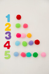 Naklejka premium Digits and Pom Poms. Numbers and dots. Counting game for early education. Preschool exercise for kids. Sequence from 1 to 10.