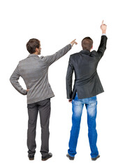 Back view of two business men in suit pointing.