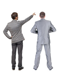 Back view of two business men in suit pointing.