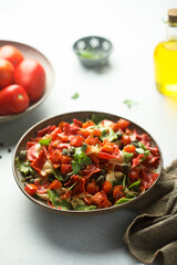 Multi-colored Italian pasta with capers and tomatoes