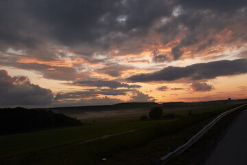 evening. sunset. field. sun. clouds