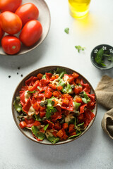 Multi-colored Italian pasta with capers and tomatoes