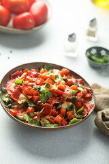 Multi-colored Italian pasta with capers and tomatoes