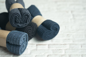 Pile of stock of dark blue and dark men underwear rolled folded