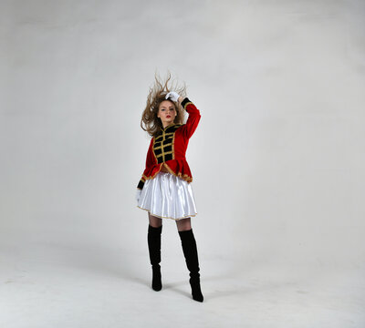 beautiful girl in red hussar uniform with loose hair