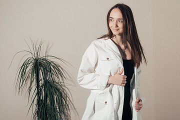 black dress and white coat 
