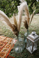 boho style wedding ceremony decorated with flowers.
