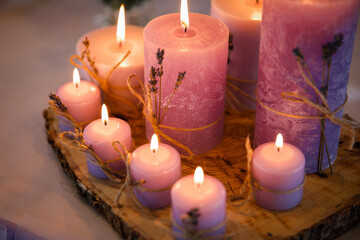 Obraz na płótnie Canvas pink candles on a wedding table close up