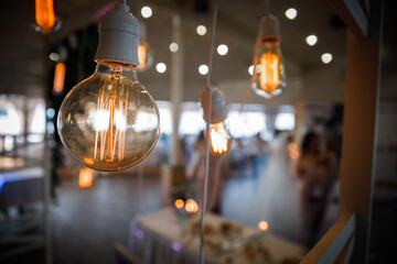 light bulbs at a wedding in the mirror reflection