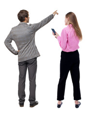 Back view of business woman and business man in suit with mobile phone.