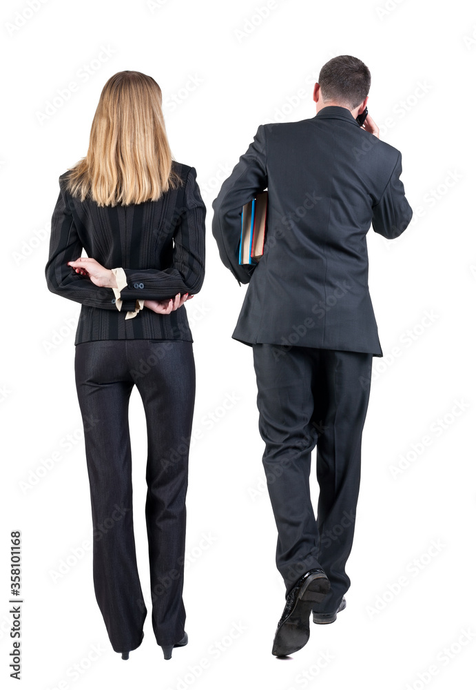 Poster Back view of business woman and business man in suit with mobile phone.