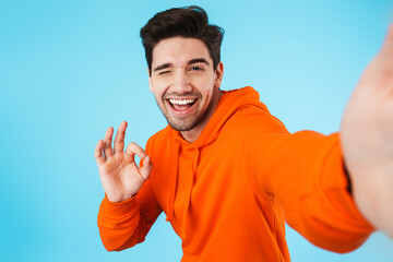 Bristle man isolated over blue wall background