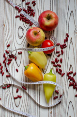 vegetables and fruits tied with a centimeter tape