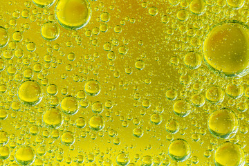 Golden yellow bubble oil or serum, Abstract Yellow water bubbles background