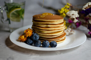 pancakes with honey and berries