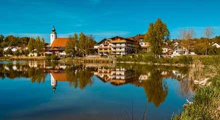 Fototapeta na wymiar Beautiful spring view with reflections at Windorf, Danube, Bavaria, Germany