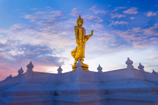 Buddha image or Buddha statue; Standing Buddha image with sunlight ray at Nong Pai Lom temple.