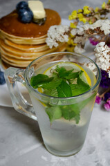 pancakes with honey, berries and cold mojito