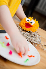 Toy for children. Fine motoric skills. Early preschool education. DIY home 5 minute craft. Kids employment at home: feed the bird with culinary tongs.