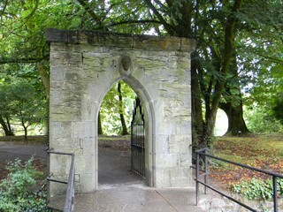 Gate to garden and Cong Woods at the Medieval Ruins of Cong Abbey in Co Mayo Ireland
