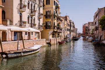 Fototapeta na wymiar Panoramic view of Venice narrow canal with historical buildings and boats