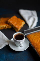 white cup of coffee on a table with a pie