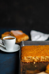 white cup of coffee on a table with a pie